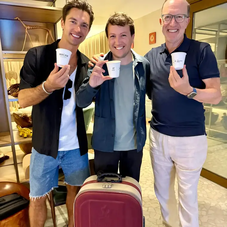 Three men holding Macaw cups in Rio de Janeiro