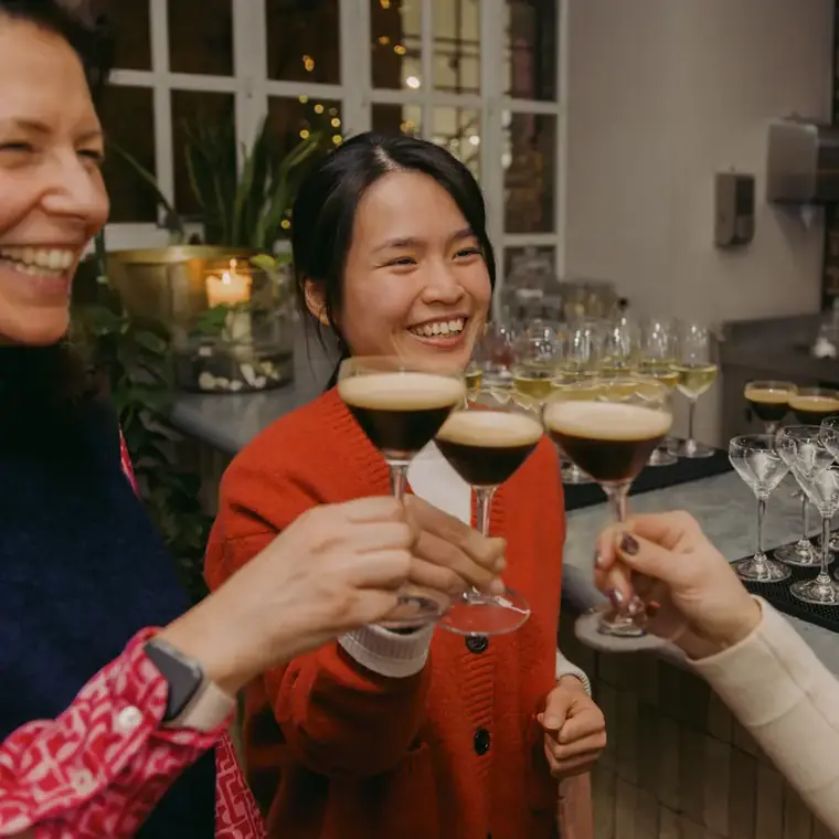 Guests toasting with espresso martinis